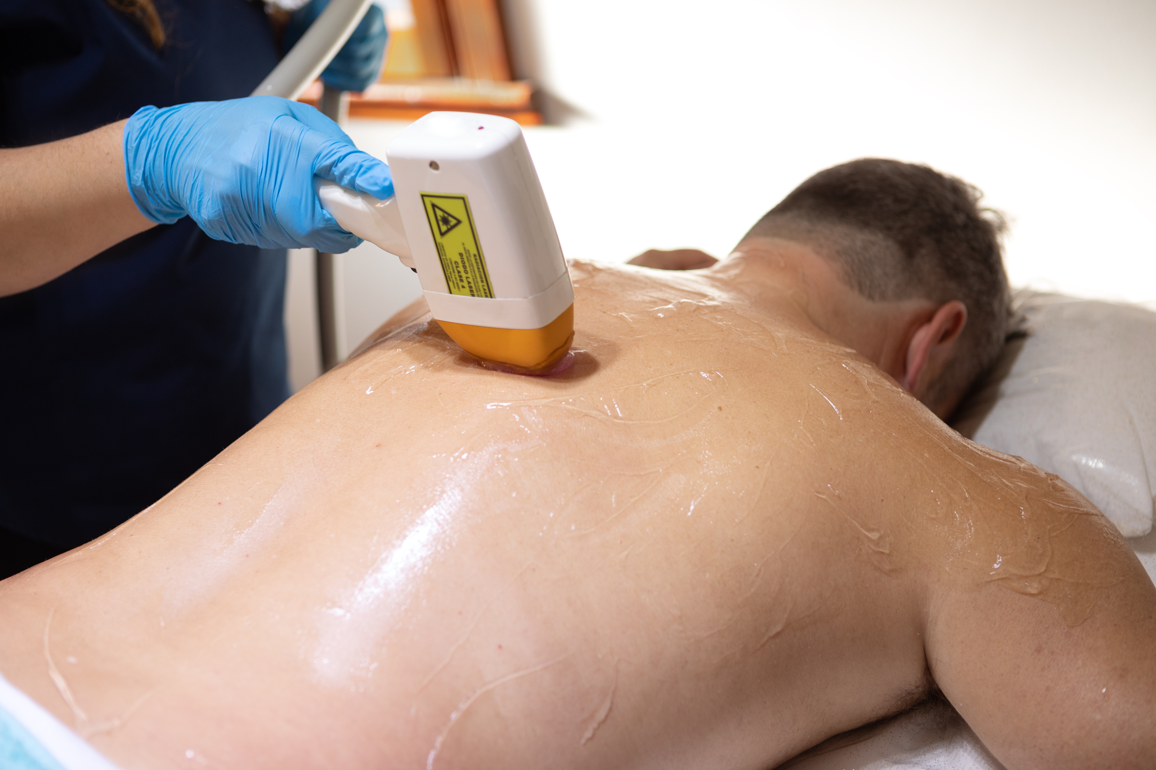 Adult man receiving laser hair removal